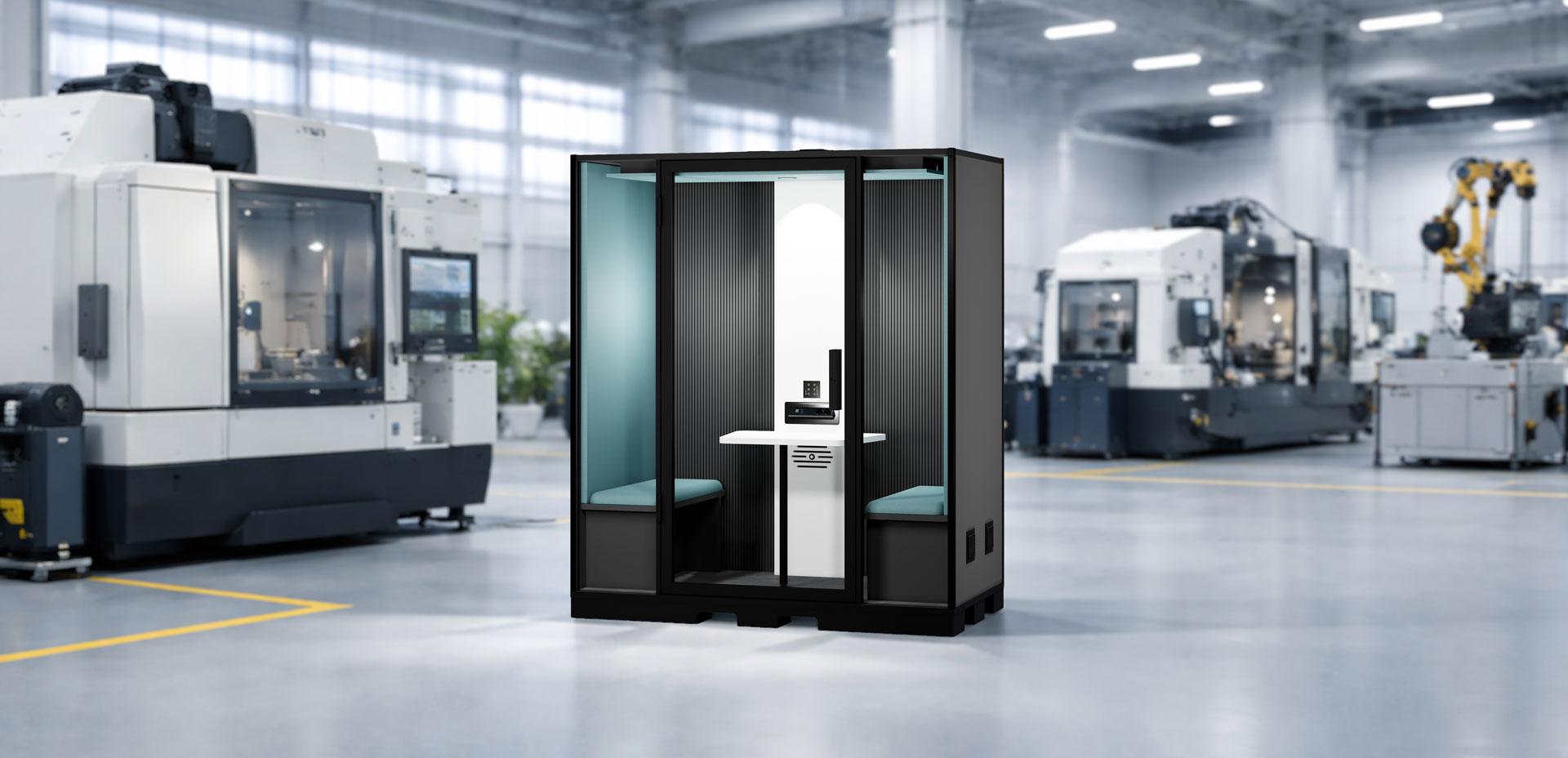 Cabine acoustique Duo Indus installée en atelier industriel pour réunions et appels en environnement bruyant