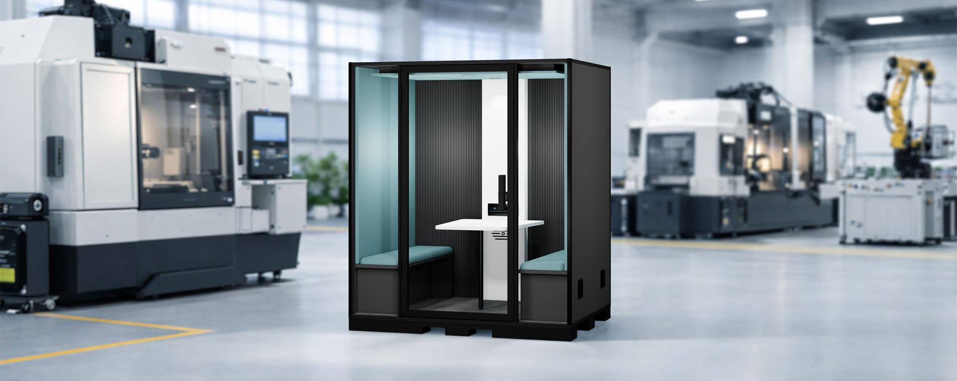 Blabla-Cube Quattro Indus acoustic booth for four people installed in an industrial workshop environment